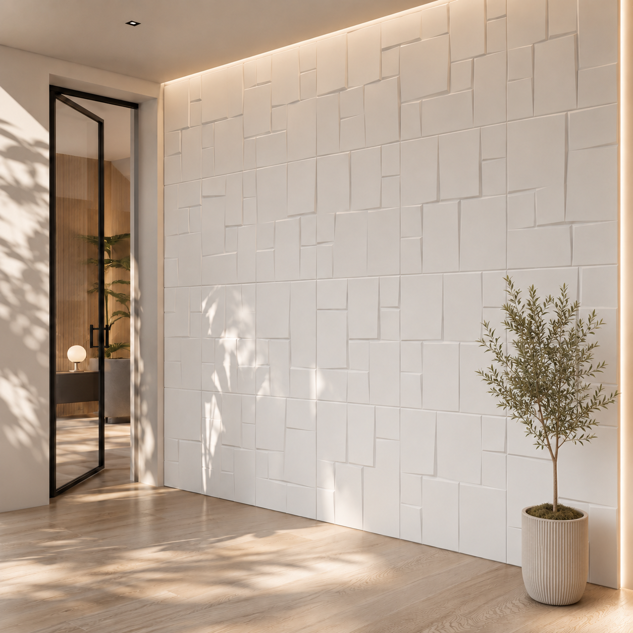 Nowoczesny korytarz z dekoracyjną ścianą z białych kasetonów 3D 50×50 cm, oświetloną naturalnym światłem podkreślającym geometryczną fakturę kwadratów.